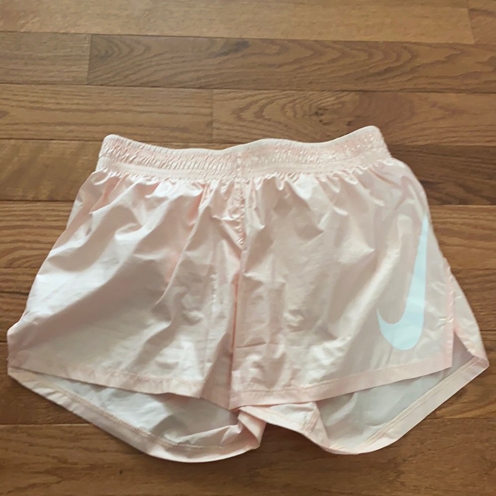 Light pink Nike running shorts. Size extra small